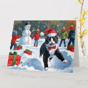 Carte Chat Tuxedo Courant dans la Neige avec un Chapeau