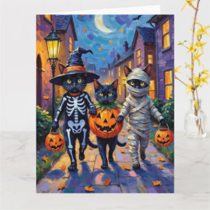 Carte Chats noirs demandant des friandises en costumes d