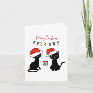 Carte Chats noirs en chapeaux de Père Noël Joyeux Noël
