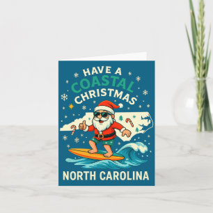 Carte Chemise de Noël côtière Nc Santa surfant sur une v
