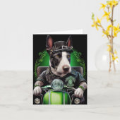 Carte Chien Bull Terrier conduisant un vélo pour la Sain (Fleur jaune)
