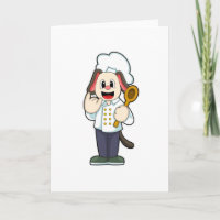 Chien comme cuisinier avec cuillère en bois et tab