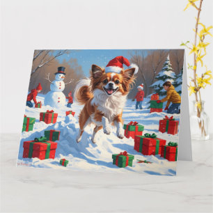 Carte Chien Papillon courant dans la neige avec un chape