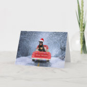 Carte Chien Rottweiler dans la neige assis dans un camio (Devant)