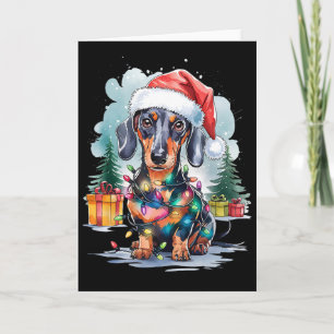 Carte Chien teckel chapeau de Père Noël lumières de Noël