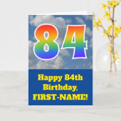 Carte Ciel bleu nuageux, Motif arc-en-ciel "84" Annivers (Fleur jaune)