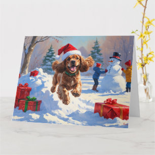 Carte Cocker Spaniel coule dans la neige avec le Casquet