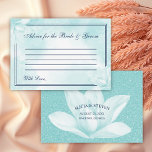 Carte Conseil Ethereal Crystal Blue Magnolia, Mariage<br><div class="desc">Carte de conseil mariage avec une fleur de magnolia bleu cristal délicate sur un arrière - plan floral abstrait dans la même teinte avec le titre : "Conseil pour la mariée et la chambre" dans un élégant script de calligraphie, entouré de deux bordures minces. À l'arrière se trouvent vos noms,...</div>