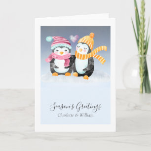 Carte Couple de manchots mignons avec chapeaux assis dan