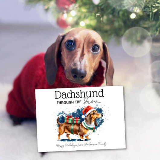 Carte Dachshund à travers la neige