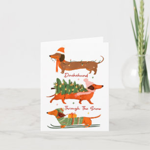 Carte Dachshund à travers la neige Joyeux Noël Dachshu