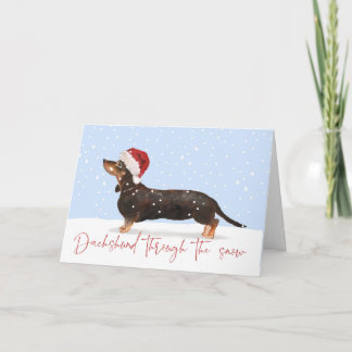 Carte DACHSHUND À TRAVERS LA NEIGE MÊME voeux de vacance