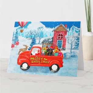 Carte Dachshund dans un camion de livraison de Noël sous