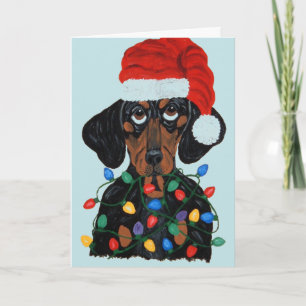 Carte Dachshund Père Noël empêtré dans les lumières de N