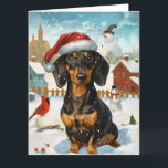 Carte Dachshund Winter Wonderland Christmas Joy<br><div class="desc">Ce design festif reflète l'esprit joyeux de la période des fêtes, avec un adorable petit portant un chapeau de Père Noël. Le chien est niché dans un pays des merveilles hivernales, avec un bonhomme de neige, un sapin de Noël décoré et des cadeaux joliment emballés. Les flocons de neige tombent...</div>