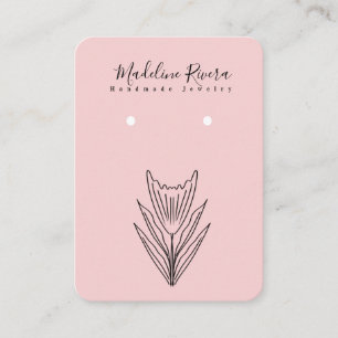 Carte d'affichage à oreille à la main rose florale