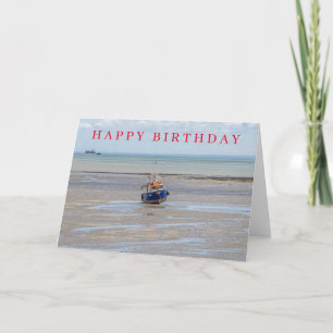 Carte d'anniversaire avec bateau bleu à marée bass
