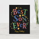 Carte d'anniversaire brillante pour le meilleur de<br><div class="desc">Une carte d'anniversaire lumineuse et joyeuse pour un "Meilleur Fils Jamais !",  avec des lettres audacieuses et à motifs sur un arrière - plan noir,  entourée de sentiers d'étoiles. Un design numérique,  adapté à tout âge,  par Judy Adamson.</div>