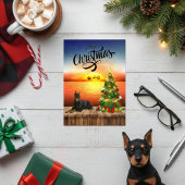 Carte de coucher de soleil de Noël Doberman