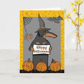 Carte de Halloween de sorcière de teckel (Fleur jaune)