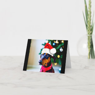 Carte de Noël avec Doberman dans le chapeau de San