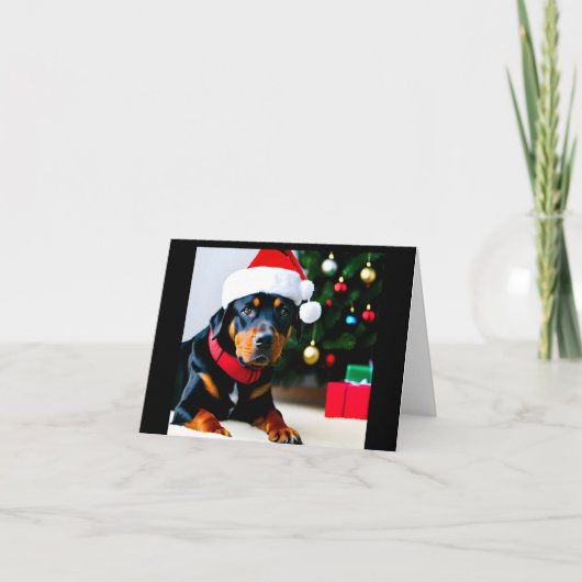 Carte de Noël avec Rottweiler portant le chapeau d (Devant)