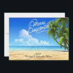 Carte de Noël Chaleureuse Sunny Beach<br><div class="desc">Vacances chaleureuses de la plage. Dans une écriture blanche est dit, "Joyeux Noël". Il y a un ciel bleu vif avec des palmiers le long du côté qui s'épuise. L'océan aux eaux cristallines s'écrase le long du sable. Découvrez les nombreuses autres scènes de plage et les produits que nous avons...</div>
