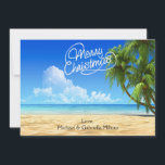 Carte de Noël Chaleureuse Sunny Beach<br><div class="desc">Vacances chaleureuses de la plage. Dans une écriture blanche est dit, "Joyeux Noël". Il y a un ciel bleu vif avec des palmiers le long du côté qui s'épuise. L'océan aux eaux cristallines s'écrase le long du sable. Découvrez les nombreuses autres scènes de plage et les produits que nous avons...</div>