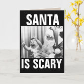 CARTE DE NOËL DRÔLE PÈRE NOËL ET ENFANT EN PLEURS (Fleur jaune)