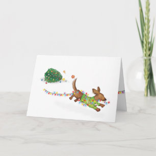 Carte de Noël d'un mignon teckel avec des lumières