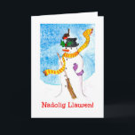 Carte de Noël mignonne galloise, Snowman et Robin<br><div class="desc">Une carte de Noël amusante avec Joyeux Noël en gallois et un robin qui a atterri sur le casquette du bonhomme de neige et profite des baies sèches. Illustration fantaisiste peinte à la main par Judy Adamson.</div>