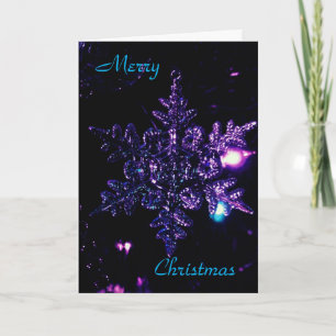 Carte de Noël noire avec l'étoile pourpre