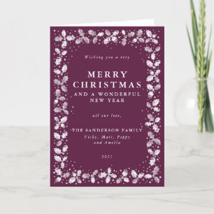 Carte de Noël pliée avec une bordure de feuilles d