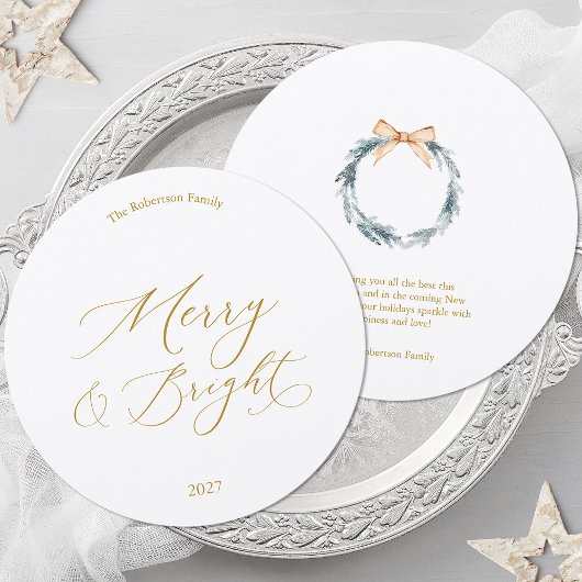 Carte de Noël ronde avec écriture dorée et couronn