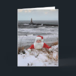 Carte de Noël Sunderland<br><div class="desc">Voici la escalade du Père Noël depuis la plage enneigée de Roker à Sunderland.

Roker Pier & Lighthouse sont dans le arrière - plan et voici The North Sea.</div>