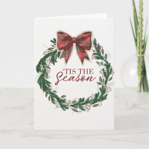 Carte de Noël vintage avec un nœud à carreaux