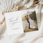 Carte De Remerciements script chic noir et blanc photo mariage<br><div class="desc">Un simple carte de remerciements mariage moderne avec un merveilleux script noir et une photo personnalisée de la mariée et du marié. Ajoutez un message de remerciement personnel à vos invités.</div>