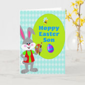 Carte de saison joyeuse de l'artiste lapin (Fleur jaune)