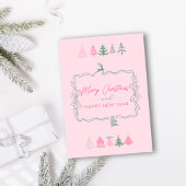 Carte de vacances rose avec ruban festif et arbres