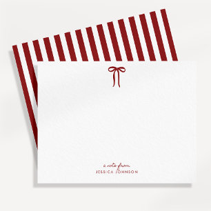 Carte de vœux à rayures rouges et nœud pour les fê