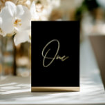 Carte De Vœux En Aluminium Elegant Black & Gold Foil Wedding Table Number<br><div class="desc">Add a touch of modern luxury to your wedding reception with this minimalist arched table number, featuring an elegant gold foil look script on clear acrylic. The design mimics real foil with a subtle printed shimmer, offering an upscale effect without the cost. Perfect for modern, chic, or romantic wedding themes....</div>