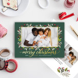 Carte De Vœux En Aluminium Joyeux chasseur de Noël Vert or Élégant Script<br><div class="desc">La carte de vacances "Joyeux Noël" présente un design de feuilles de verdure fleurie et de baies avec un élégant texte de salut et cadre en or réel moderne autour de l'image. Personnalisez le texte simple avec une signature familiale et l'année, et choisissez d'inclure un message supplémentaire au verso de...</div>