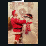 Carte de voeux père Noël & Snowman<br><div class="desc">Ho Ho Ho ! C'est l'heure de Noël et Père Noël construit un bonhomme de neige. Un regard nostalgique sur cette fantastique image de vacances. Sur la carte on peut lire "Joyeux Noël !"</div>