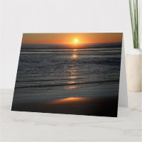 Carte de vœux photo du coucher de soleil sur la cô