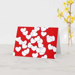 Carte de vœux pliée rouge avec cœurs d'amour blanc