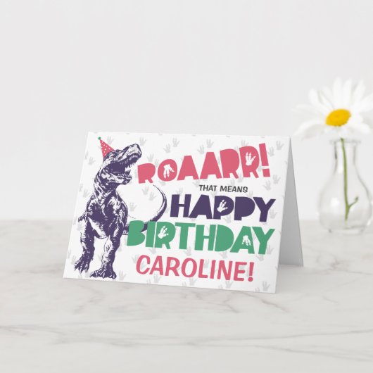 Carte Dinosaur T-Rex dans un Casquette de fête rose joye (Petite plante)