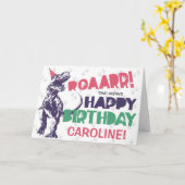 Carte Dinosaur T-Rex dans un Casquette de fête rose joye (Fleur jaune)