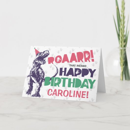 Carte Dinosaur T-Rex dans un Casquette de fête rose joye (Devant)
