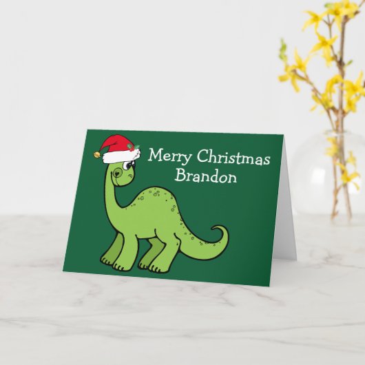 Carte Dinosaure de Noël mignon à Santa Hat Custom Green (Fleur jaune)