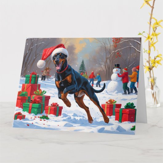 Carte Doberman coule dans la neige avec le Casquette de (Fleur jaune)